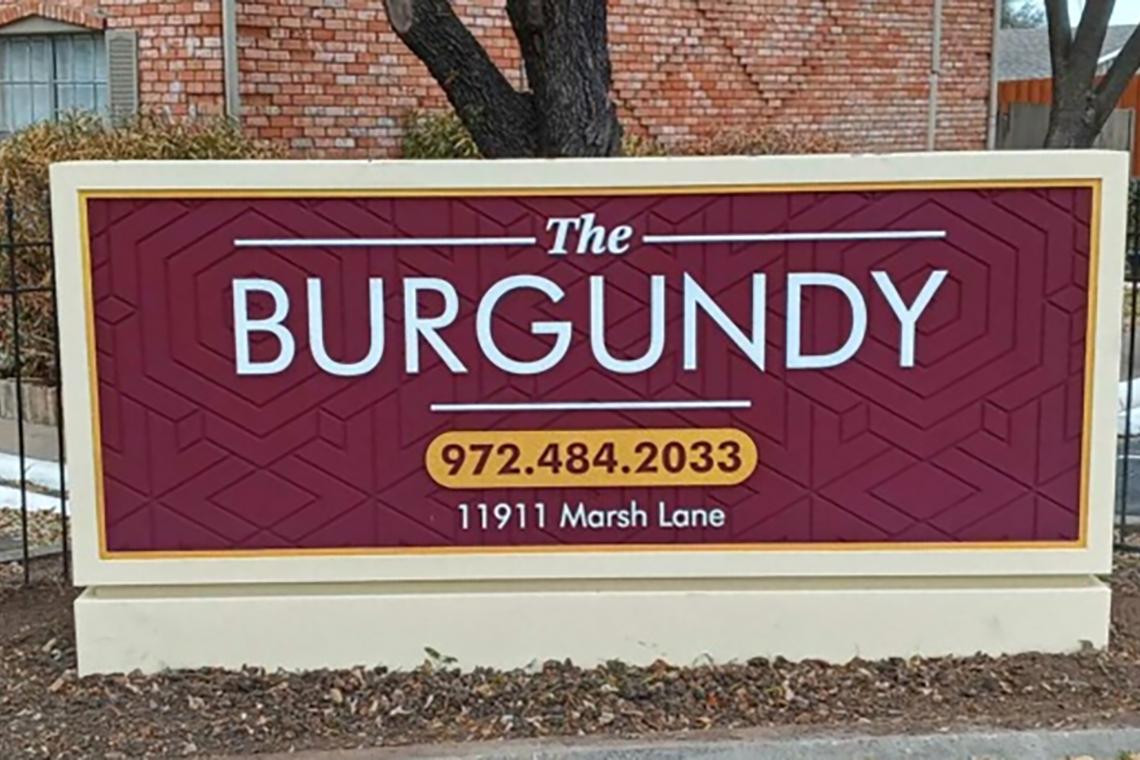 monument sign of The Burgundy apartments. This is an example of investing in apartment complexes for an asset that has sold.